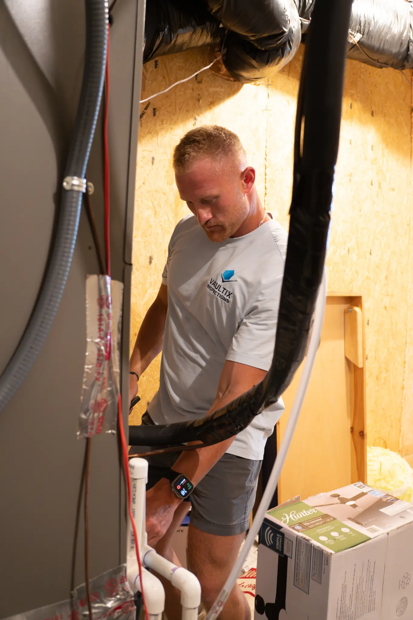 Close-up of hands-on residential inspection work